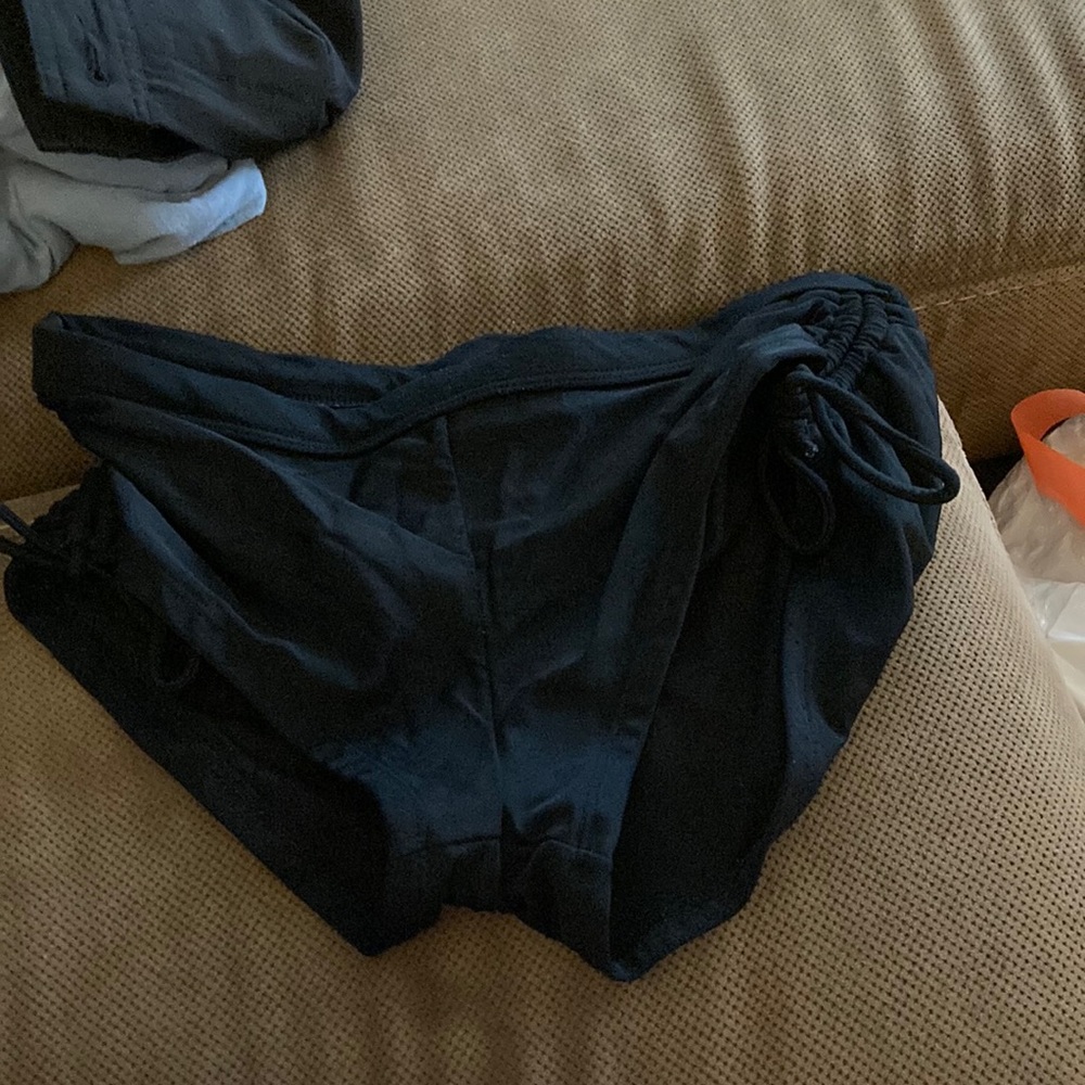 Used black bath suit bottoms